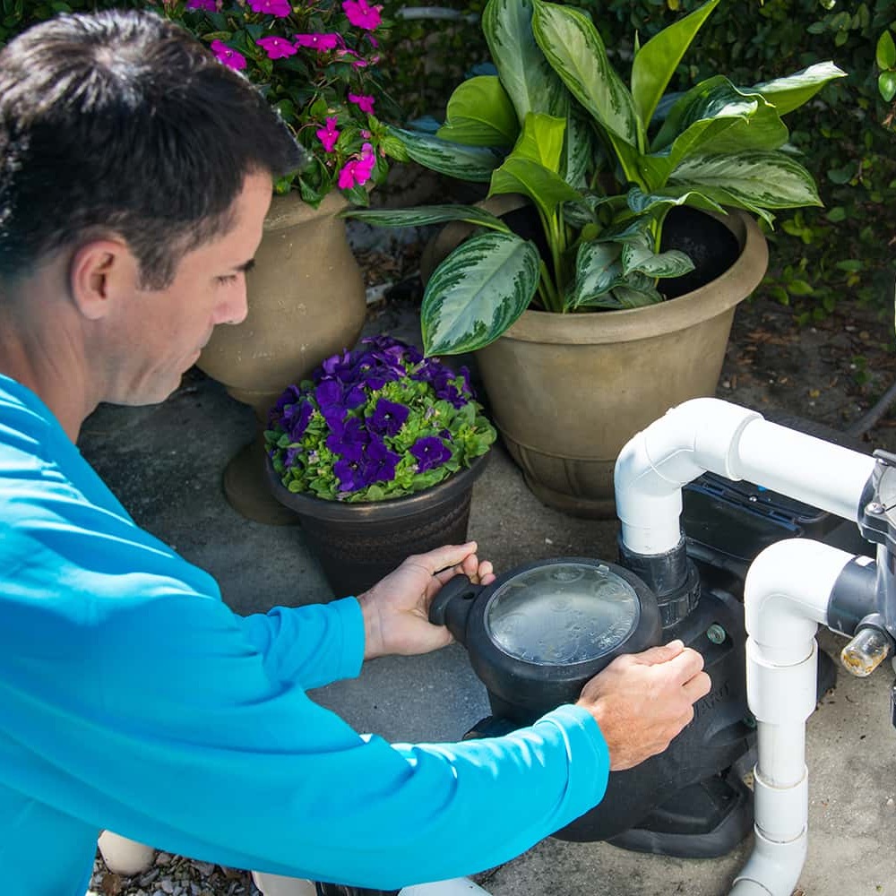 Skilled technician from Mawby's Pools diagnosing pool equipment issues in Cleveland South Euclid, showcasing expertise and dedication