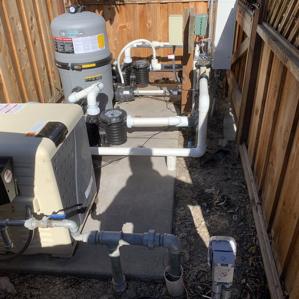 Technician optimizing pool equipment for energy efficiency in Cleveland South Euclid, reflecting Mawby's Pools' commitment to quality