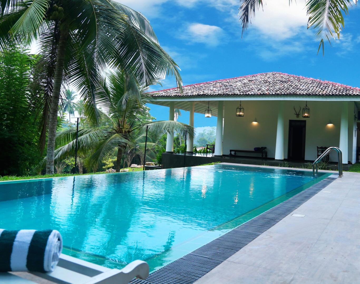 Scheduled weekly cleaning during Pool Service near me at a private home swimming pool by Mawby's Pool Service