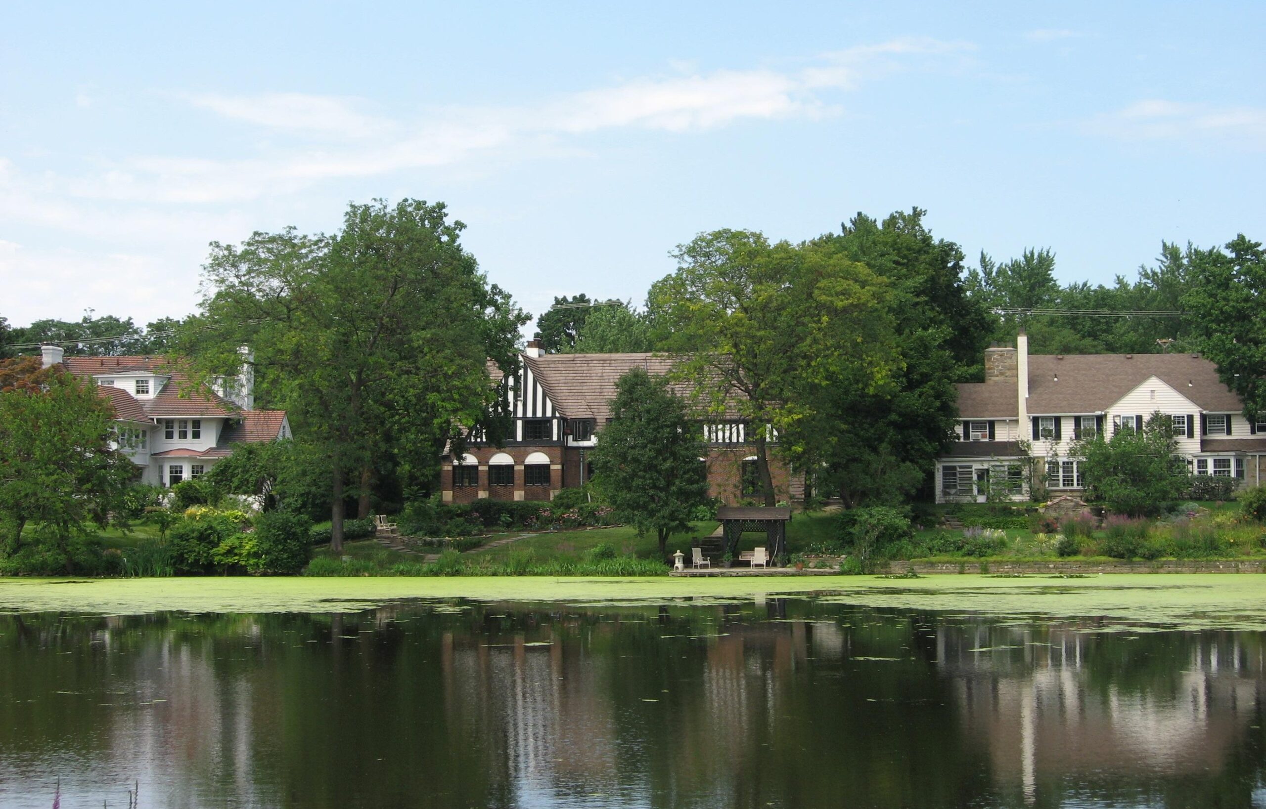 A picture of 3 houses across from green lake in Shaker Heights, Ohio